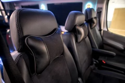 Comfortable interior of a passenger bus with soft seats Stock Photos