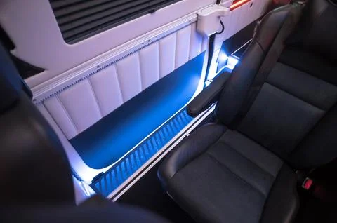 Comfortable interior of a passenger bus with soft seats Stock Photos