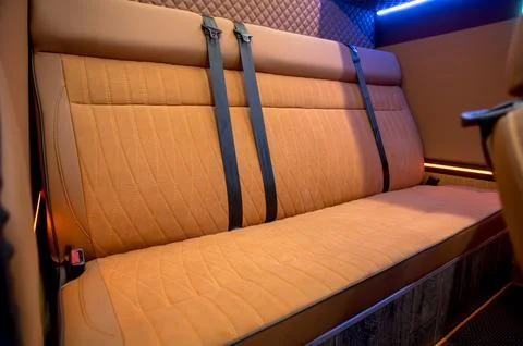 Comfortable interior of a passenger bus with soft seats Stock-Fotos
