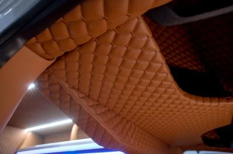 Comfortable interior of a passenger bus with soft seats Stock Photos