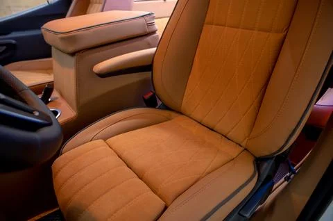 Comfortable interior of a passenger bus with soft seats Stock Photos