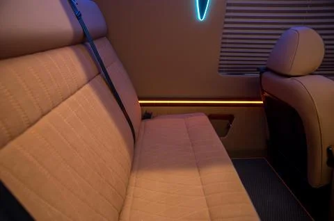 Comfortable interior of a passenger bus with soft seats Stock-Fotos