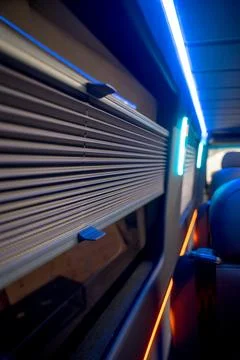 Comfortable interior of a passenger bus with soft seats Stock Photos