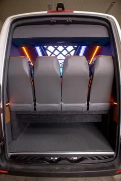 Comfortable interior of a passenger bus with soft seats Stock Photos