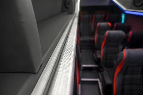 Comfortable interior of a passenger bus with soft seats Stock-Fotos