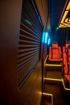 Comfortable interior of a passenger bus with soft seats Stock Photos