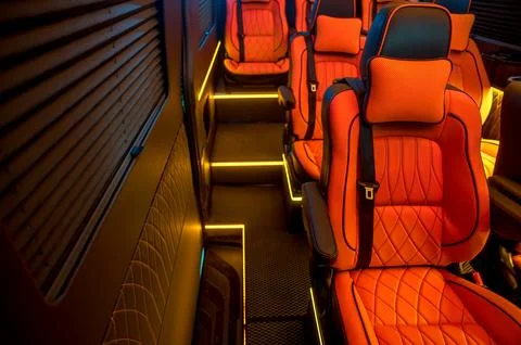 Comfortable interior of a passenger bus with soft seats Foto stock
