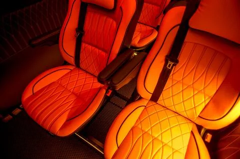 Comfortable interior of a passenger bus with soft seats Stock Photos