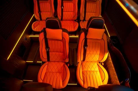 Comfortable interior of a passenger bus with soft seats Stock Photos