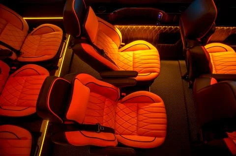Comfortable interior of a passenger bus with soft seats Stock Photos