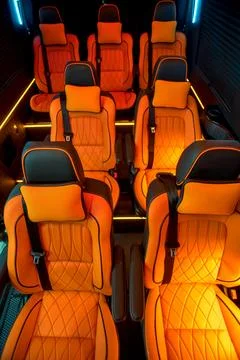 Comfortable interior of a passenger bus with soft seats Stock Photos