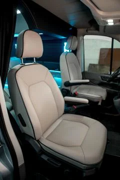 Comfortable interior of a passenger bus with soft seats Stock Photos