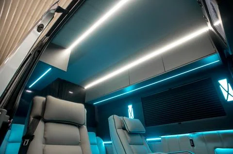 Comfortable interior of a passenger bus with soft seats 스톡 사진