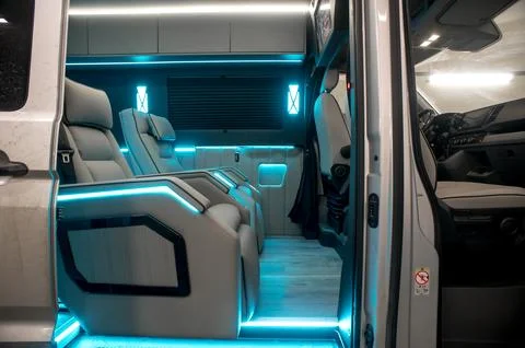 Comfortable interior of a passenger bus with soft seats Stock-Fotos