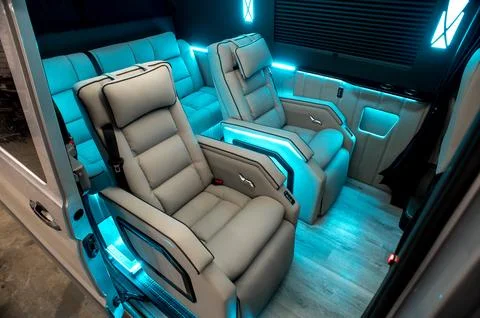 Comfortable interior of a passenger bus with soft seats Stock-Fotos