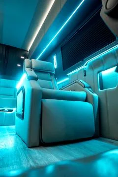 Comfortable interior of a passenger bus with soft seats Stock Photos