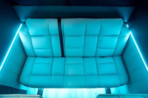 Comfortable interior of a passenger bus with soft seats Stock Photos