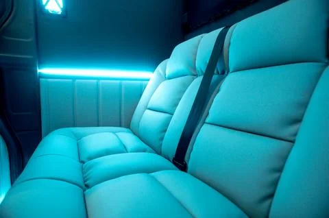 Comfortable interior of a passenger bus with soft seats Stock Photos