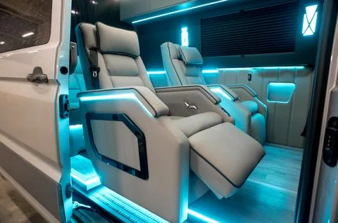 Comfortable interior of a passenger bus with soft seats Stock-Fotos