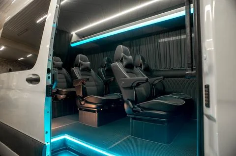 Comfortable interior of a passenger bus with soft seats Stock-Fotos