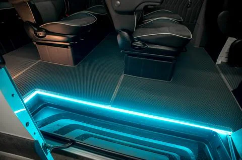 Comfortable interior of a passenger bus with soft seats Stock Photos