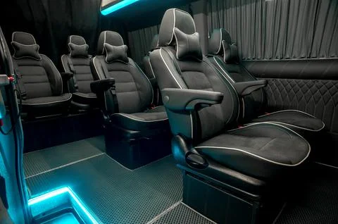 Comfortable interior of a passenger bus with soft seats Foto stock