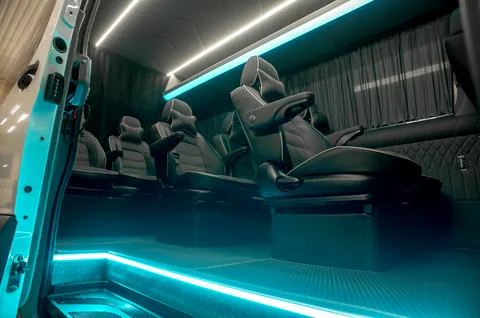 Comfortable interior of a passenger bus with soft seats Stock-Fotos