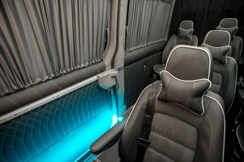Comfortable interior of a passenger bus with soft seats Foto stock