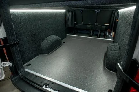 Comfortable interior of a passenger bus with soft seats Stock Photos