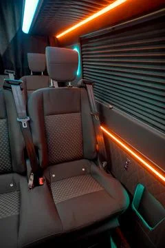 Comfortable interior of a passenger bus with soft seats Stock Photos