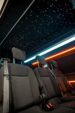 Comfortable interior of a passenger bus with soft seats Stock Photos