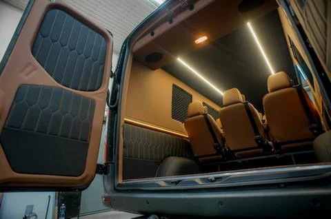Comfortable interior of a passenger bus with soft seats Stock Photos