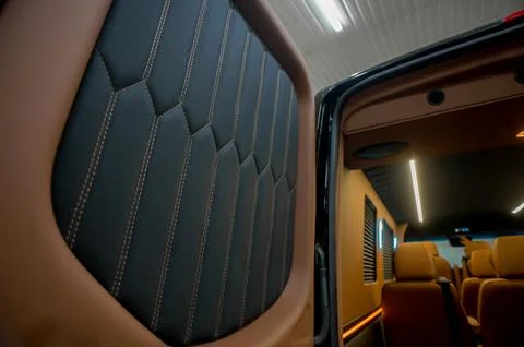 Comfortable interior of a passenger bus with soft seats Stock Photos