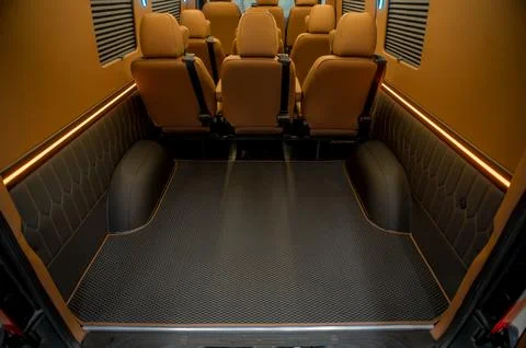 Comfortable interior of a passenger bus with soft seats Foto stock
