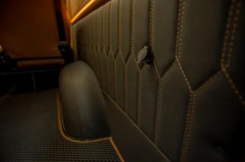 Comfortable interior of a passenger bus with soft seats Stock Photos