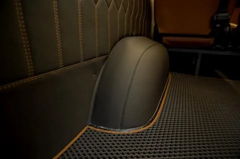 Comfortable interior of a passenger bus with soft seats Stock Photos