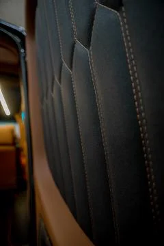 Comfortable interior of a passenger bus with soft seats Stock Photos