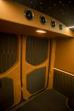Comfortable interior of a passenger bus with soft seats Stock Photos