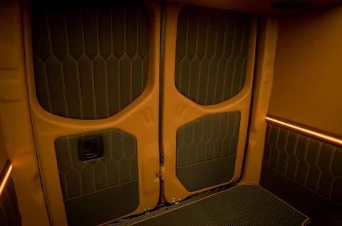 Comfortable interior of a passenger bus with soft seats Stock Photos
