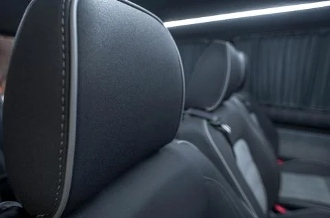 Comfortable interior of a passenger bus with soft seats Stock Photos