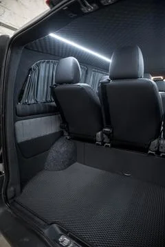 Comfortable interior of a passenger bus with soft seats Stock Photos