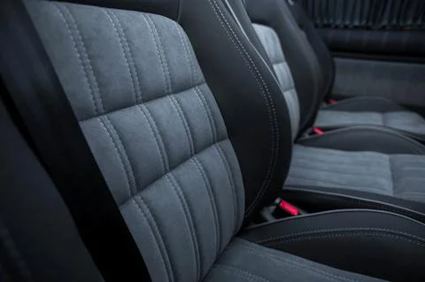 Comfortable interior of a passenger bus with soft seats Stock Photos