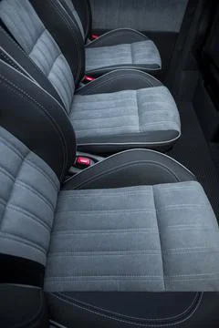 Comfortable interior of a passenger bus with soft seats Stock Photos
