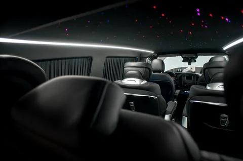 Comfortable interior of a passenger bus with soft seats Stock Photos