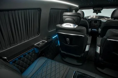 Comfortable interior of a passenger bus with soft seats Stock Photos