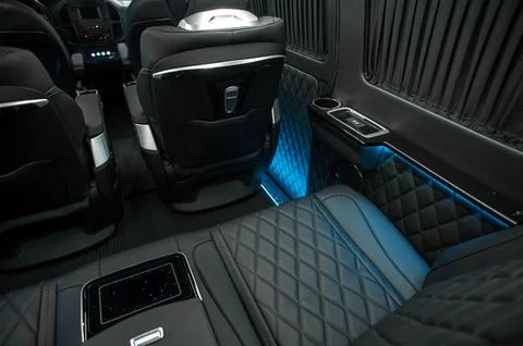 Comfortable interior of a passenger bus with soft seats Stock Photos