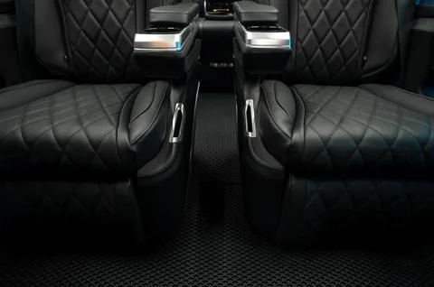 Comfortable interior of a passenger bus with soft seats Stock-Fotos