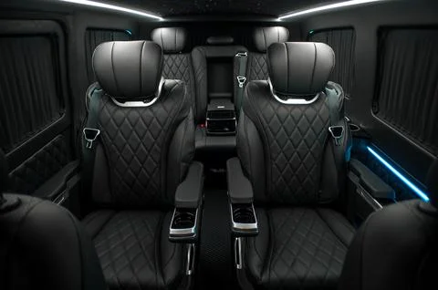 Comfortable interior of a passenger bus with soft seats Stock-Fotos