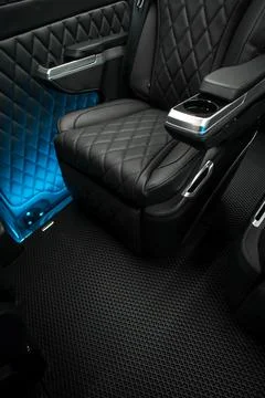 Comfortable interior of a passenger bus with soft seats Stock Photos
