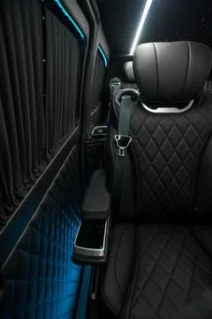 Comfortable interior of a passenger bus with soft seats Stock Photos